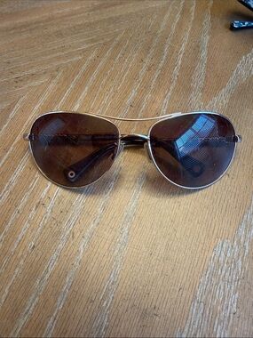 Coach ALLEGRA Gold Frame Sand is the color Aviator Sunglasses with Brown Lenses